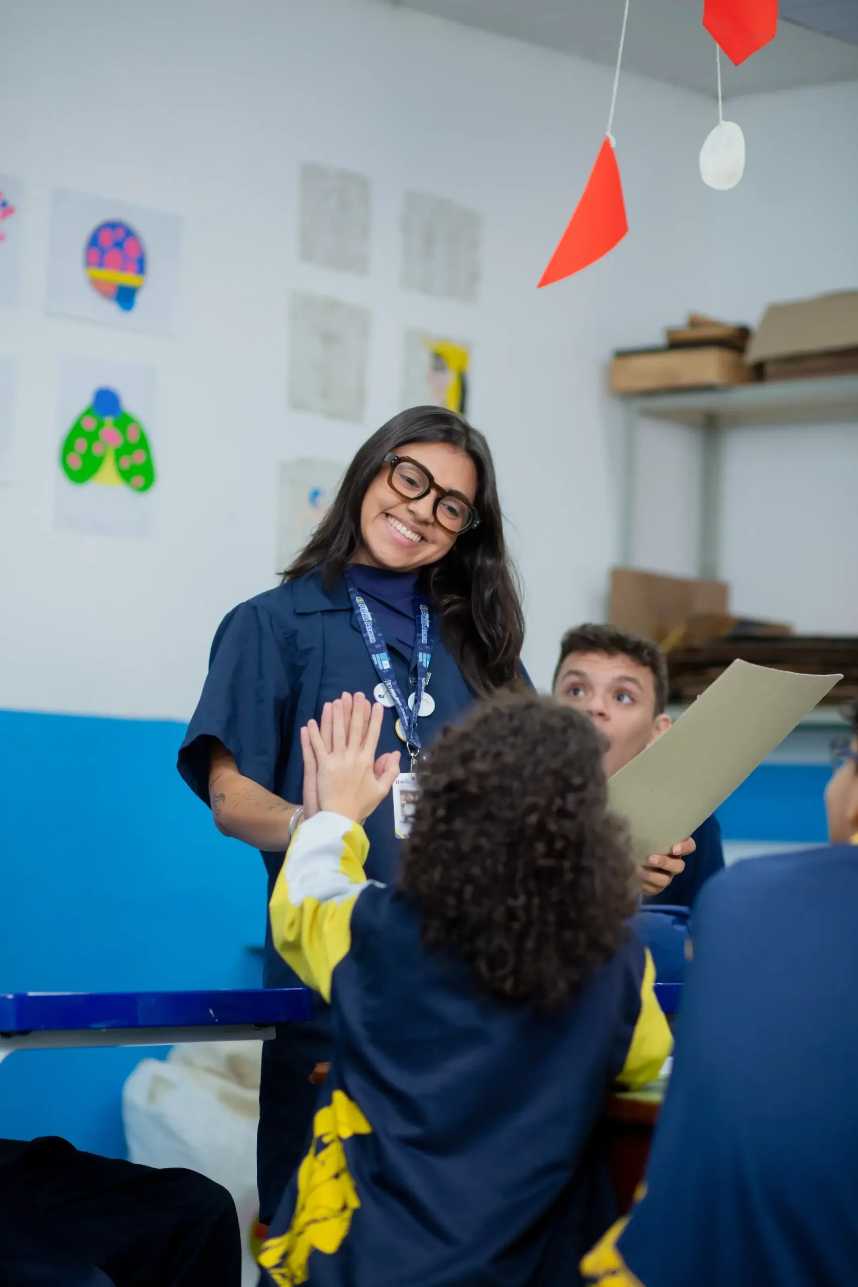 A Palas Atena teacher working with students in the classroom